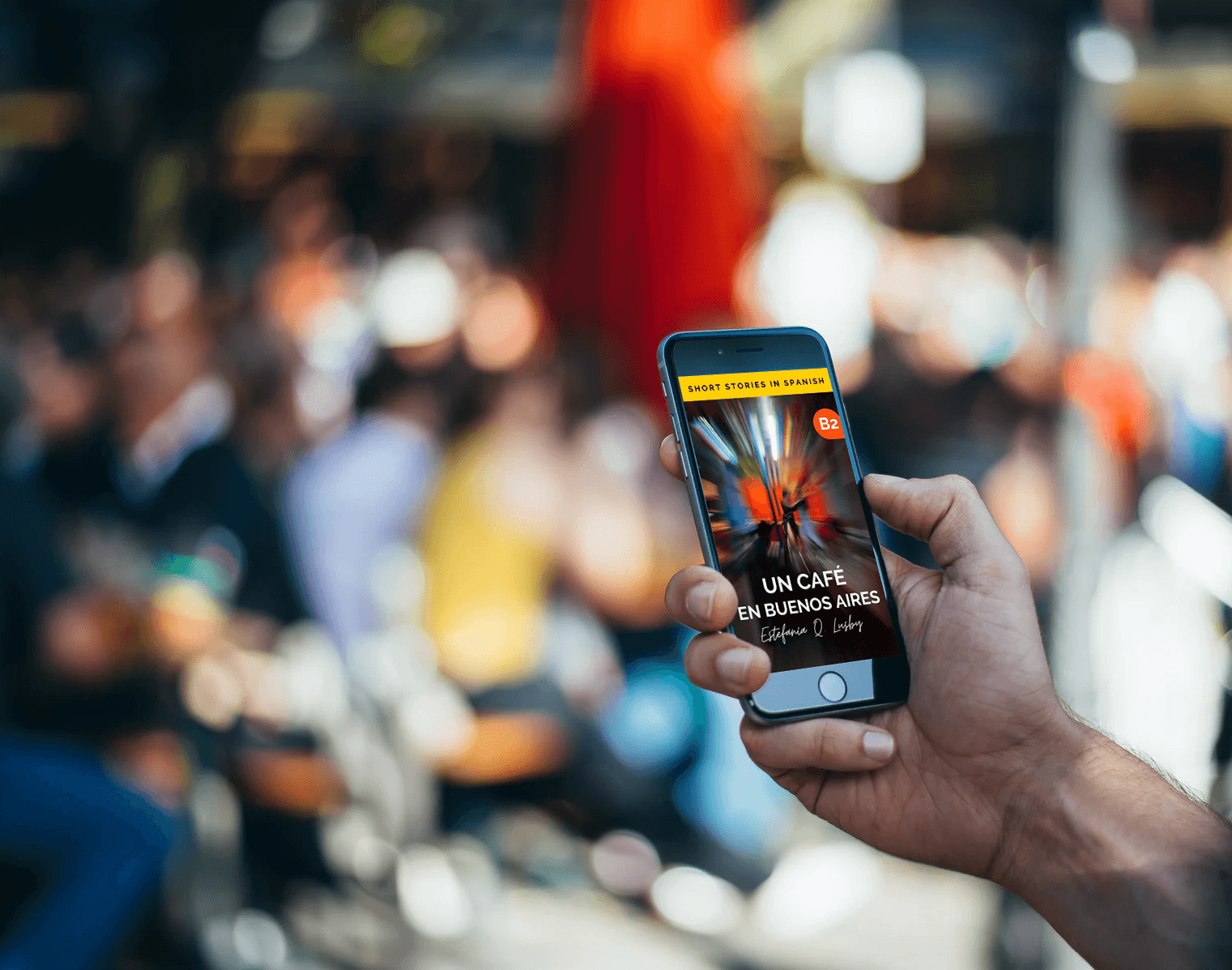 A reader holding a phone displaying a Short Stories in Spanish book cover